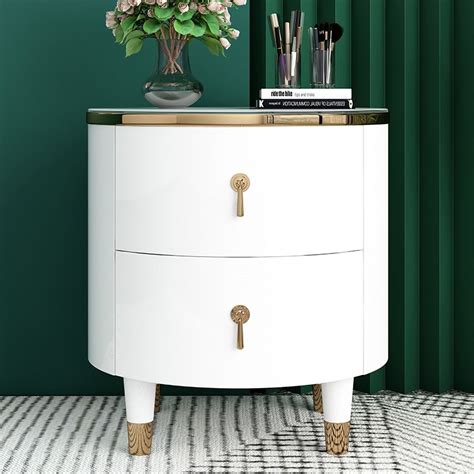 This Modern White Nightstand Features A Circular Top And Gold Legs For