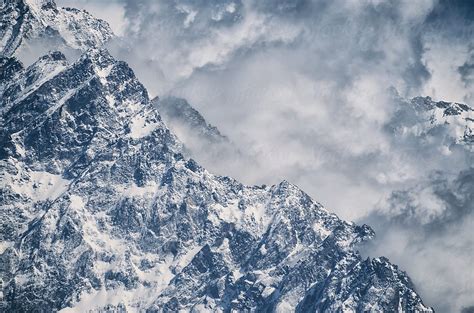 Snowy Mountain Peaks Mixed With Clouds By Stocksy Contributor Alice