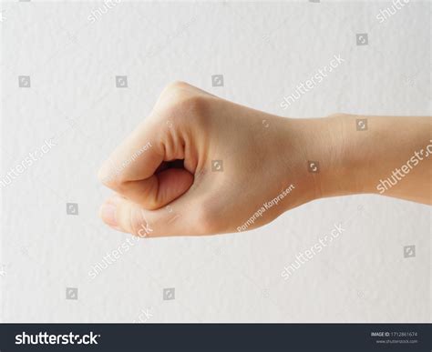 Hand Gesture Female Hand Clenched Punching Stock Photo 1712861674