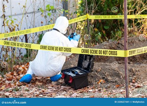 Crime Scene Investigation Forensic Science Specialist Photographing Human Remains Stock Image