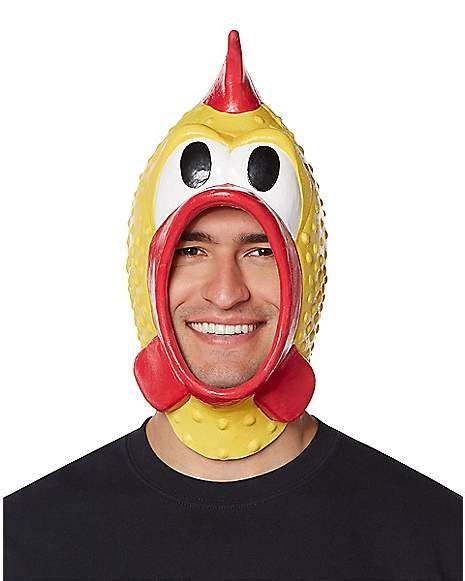 A Man Wearing A Yellow And Red Chicken Mask