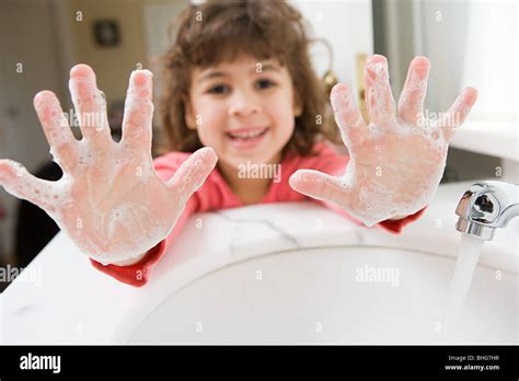 Girl With Soap On Her Hands Stock Photo Alamy