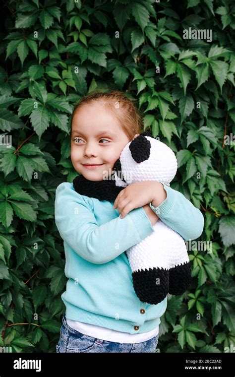 Emotional Girl Hugging Her Toy Panda Little Girl In Love With Her