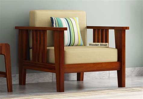 The living room furniture of wooden alley in a home is the focal point and requires a lot of attention. Buy Mcleod 1 Seater Wooden Sofa (Honey Finish) Online in ...