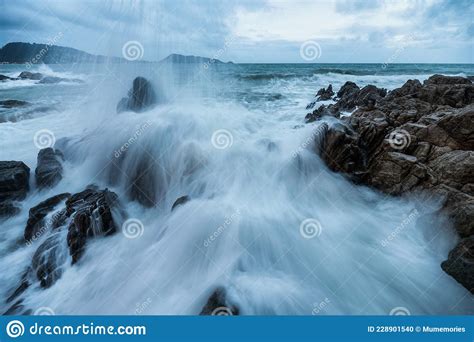 Powerful Big Wave Hitting And Splashing On The Rock Of Coastline Stock
