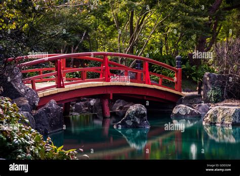Red Japanese Bridge Above Water Stock Photo Alamy