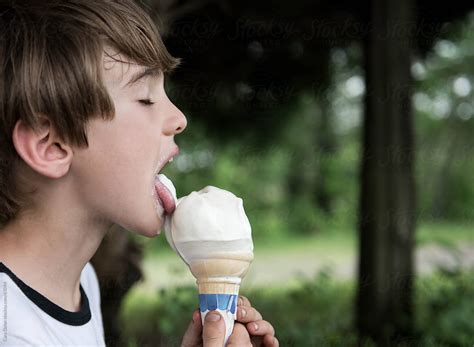 Boy Closes Eyes As He Licks His Vanilla Ice Cream Cone By Cara Dolan
