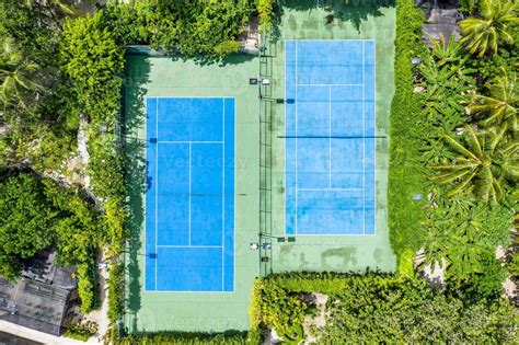 Amazing Birds Eye View Of A Tennis Court Surrounded By Palm Trees