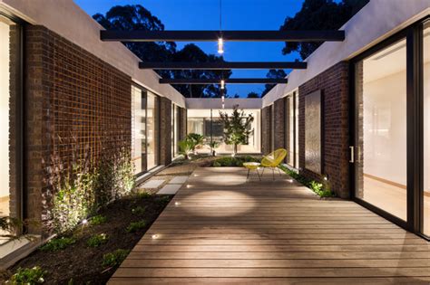 The beach home and coastal mediterranean style floor plans often have an attached these luxury house plans are set up so that the main rooms open out to a courtyard. Courtyard House Indoor Courtyard - Modern - Exterior ...