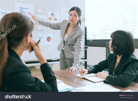 Elegant Young Business Woman Giving Presentation Company Report Graph