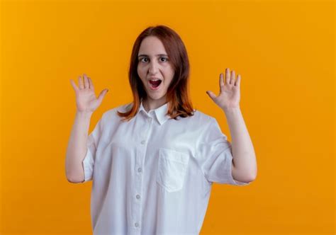 Free Photo Surprised Young Redhead Girl Spreads Hands Isolated On