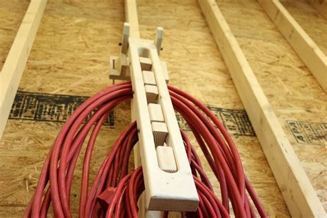 The extension cord involves the user to be able to push a cord in to a socket. DIY Folding Extension Cord Organizer - DIY projects for everyone!