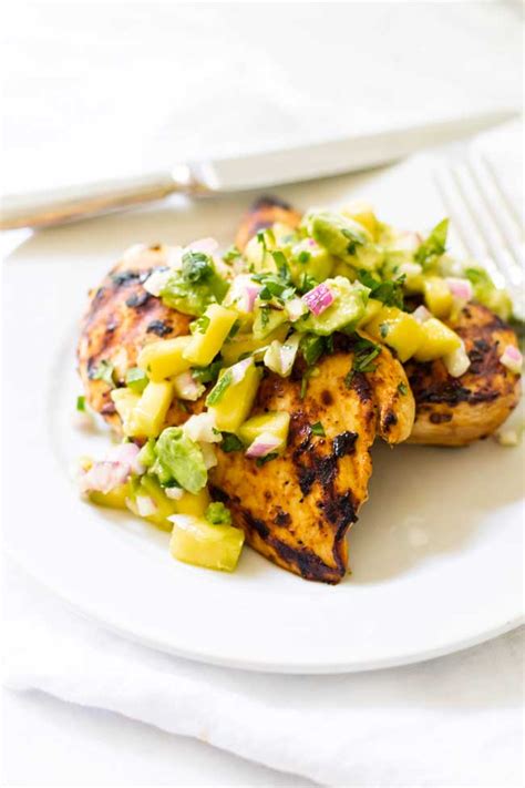 Place each grilled chicken piece on the bottom half of the sandwich thins. Mango Avocado Salsa with Grilled Chipotle Chicken | Girl ...