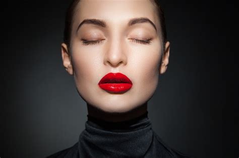 Premium Photo Young Model With Eyes Closed And Red Lips On Black