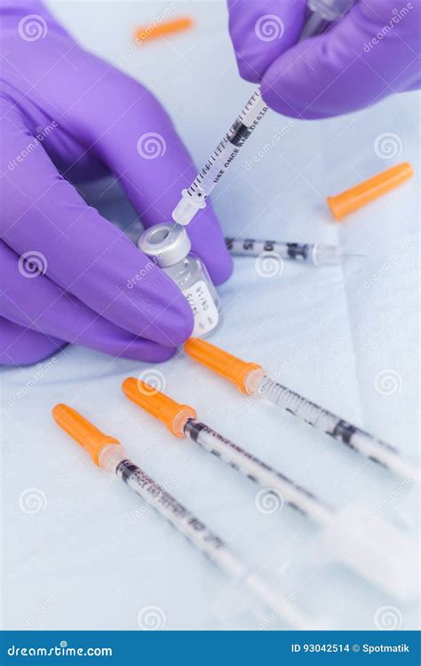 Cosmetic Surgeon Doctor Filling Botox Syringe From Vial Stock Photo