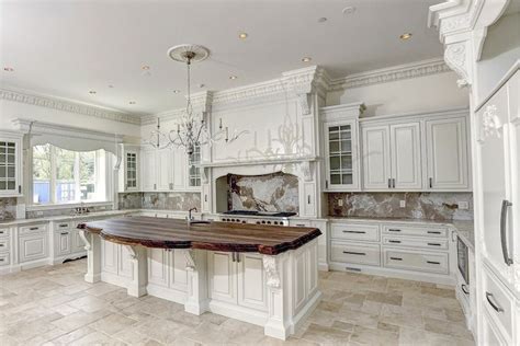All of our wood island legs, columns and post legs are unfinished and ready for you to stain, seal or paint. white kitchen with carved wood molding and acanthus leaf ...