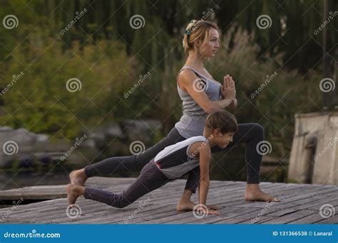 Mother And Son Exercising Yoga Pose Stock Photo Image Of Emotion Position