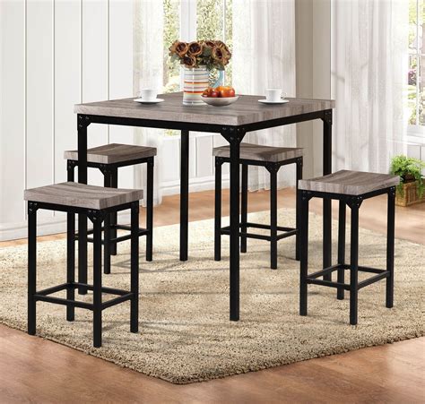 They are differentiated from more traditional dining room sets mainly because both the table and the chairs are taller. F2141 5 Pcs Counter Height Table Set by Poundex