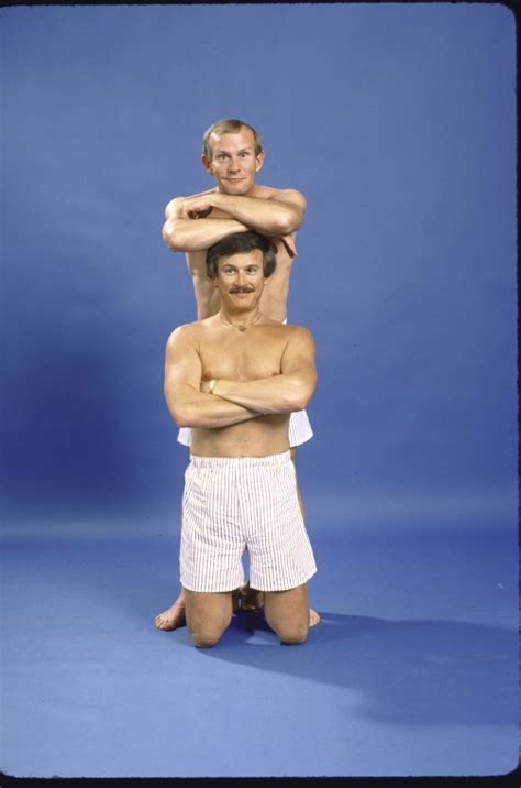 actor brothers tommy smothers top and dick smothers bottom in a publicity shot for the