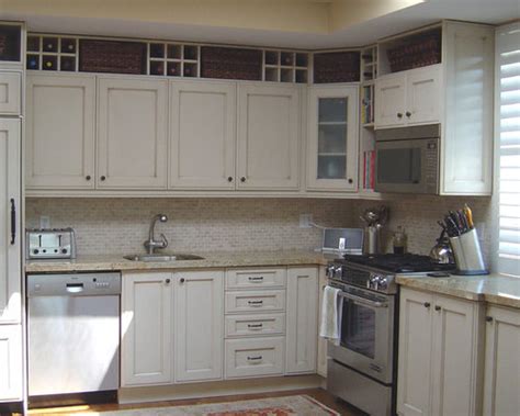 If the space above your cabinets doesn't create a ledge, or if you're not in the habit (or desire) of displaying collections of things, consider making this space an extension of your art gallery. Space Above Kitchen Cabinet | Houzz