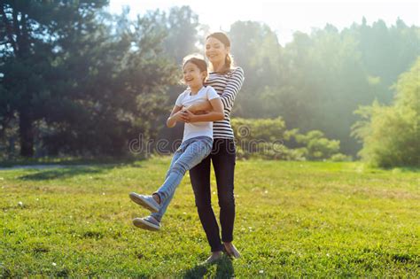 Happy Mother Spinning Her Daughter In Park Stock Image Image Of Nature Custody 98066645