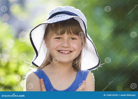 Close Up Portrait Of Happy Smiling Little Girl In A Big Hat Child