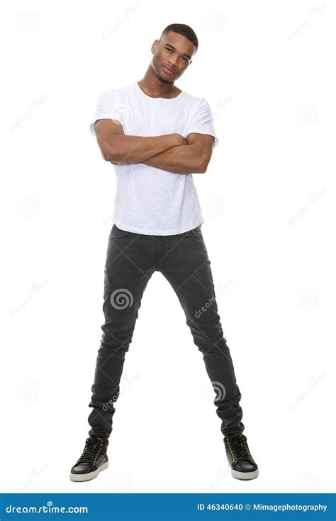Portrait Of A Confident Young Man Posing With Arms Crossed Stock Photo