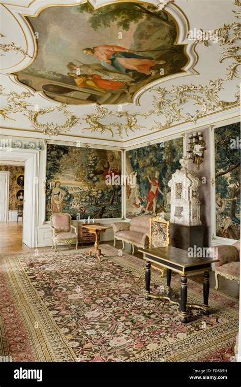 Rococo Stucco Ceiling Above Patterned Rug With Antique Furniture In