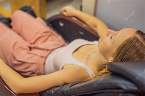 Premium Photo Beautiful Young Woman Relaxing On The Massage Chair In