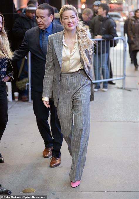 Amber Heard Sheds Her Racy Look As She Power Dresses In A Pinstripe