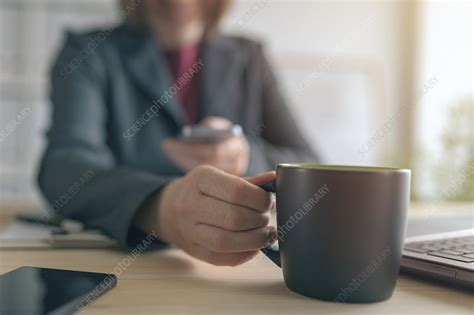 Businesswoman Texting During Coffee Break Stock Image F Science Photo Library