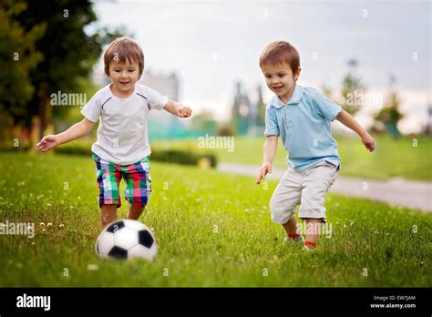 Two Cute Little Boys Playing Football Stock Photo Alamy