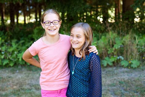 11 and 9 year old sisters enjoying their last day of summer vacation by stocksy contributor