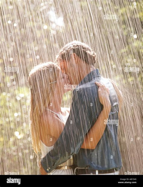 Romantic Couple Kissing In The Rain Stock Photo Alamy