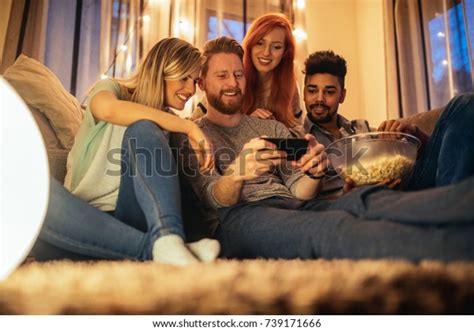 This is a list, in no particular order, of horror movies (and some tv) my family has watched that we thought were good enough to. Group Friends Enjoying Late Night Movie Stock Photo (Edit ...