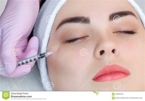 The Doctor Cosmetologist Makes The Botulinum Toxin Injection Procedure