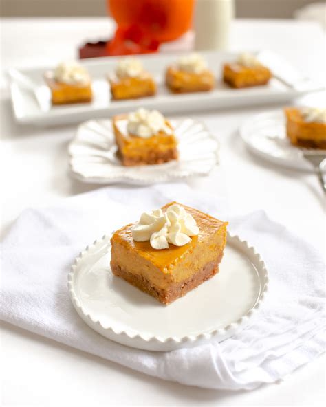pumpkin cheesecake squares with maple whipped cream chic and sugar