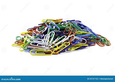 A Stack Of Paper Clips Isolated Against A White Background Stock Photo