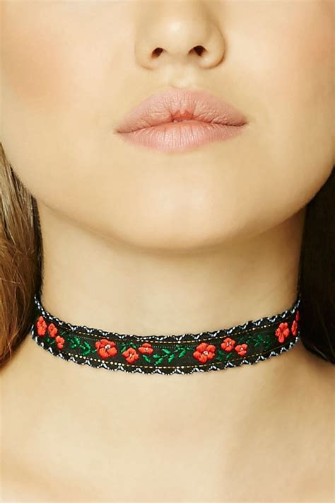 A Woven Choker Featuring A Floral Embroidery And A Lobster Clasp