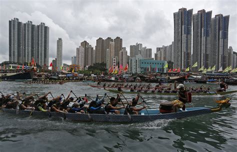 Rowing Enthusiasts Participate In A Dragon Boat Race Near Hong Kongs