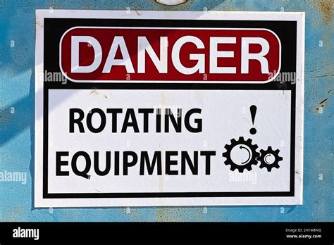 Closeup Of A Danger Rotating Equipment Sign Stock Photo Alamy