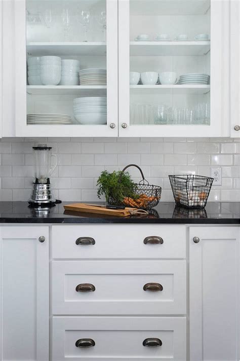 Neutral colored walls, backsplashes, and flooring will really make the white cabinets and granite countertops pop. Farmhouse kitchen cabinet ideas. Simple farmhouse kitchen ...