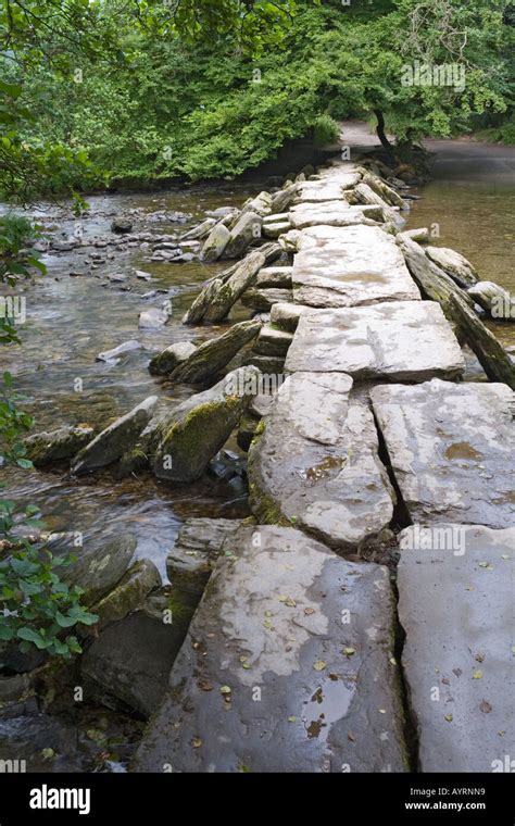 The Prehistoric Clapper Bridge Across The River Barle At Tarr Steps