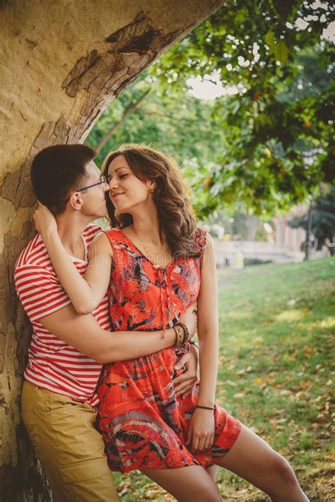 Happy Couple In A Kiss And Hug Romantic Moment Stock Image