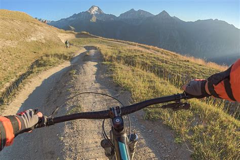 Mountain Bike Handlebar Controlled By Biker Riding In On Sunny Trail Del Colaborador De