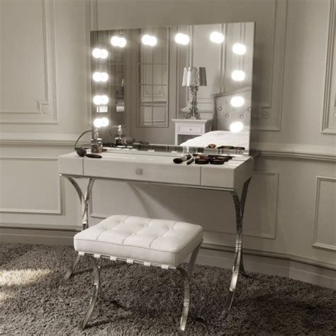 To avoid dark spots at a long vanity, consider mounting a dual sconce in the center with single sconces at the outer edges of the mirrors and vanity. White Makeup Vanity for a Bedroom | Hollywood mirror with ...