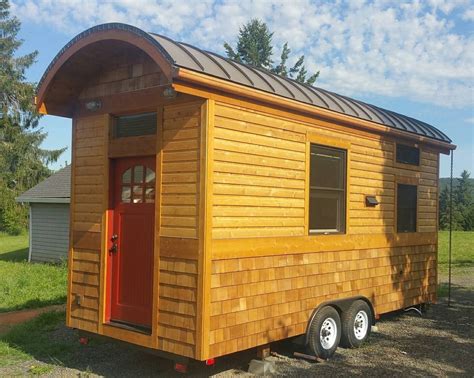 Although this cozy home is way below the average size, it features an ultra functional design that takes advantage of every nook and cranny to provide you with everything you need. Vardo Style Tiny House on Wheels For Sale in Banks, Oregon