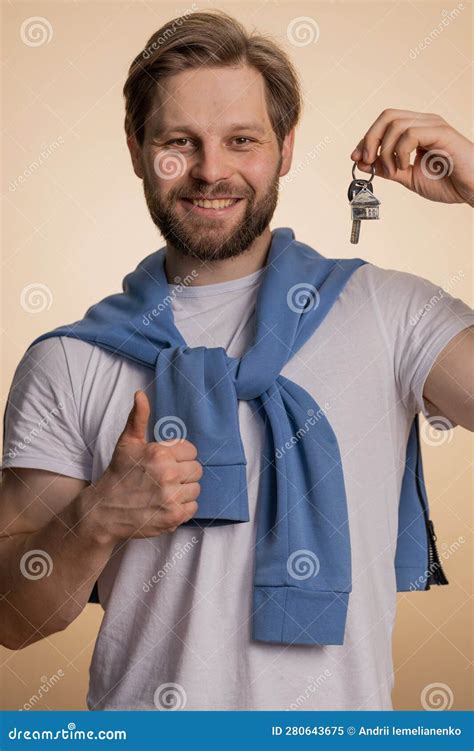 Happy Man Real Estate Agent Showing Keys Of New Home House Apartment Buying Renting Property
