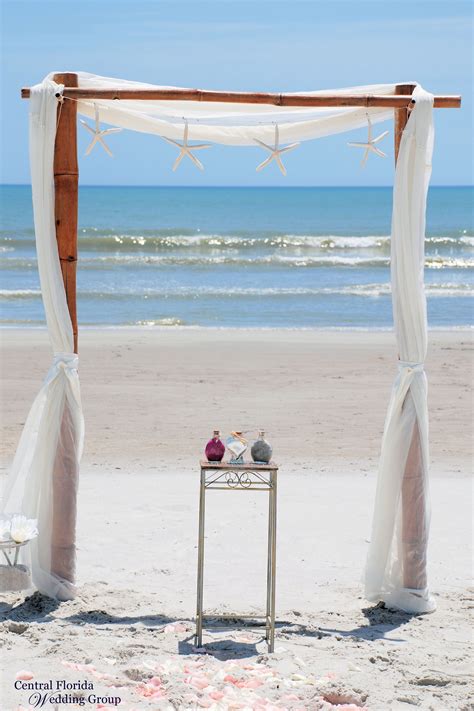 Beach Wedding Setup With 2 Post Bamboo Arch And Hanging Starfish