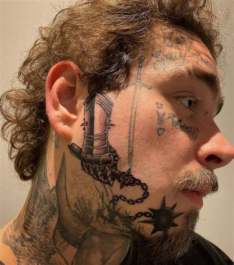 Gauntlet And Flail Tattoo On Post Malone S Face Post Malone Face Tattoo Face Tattoos